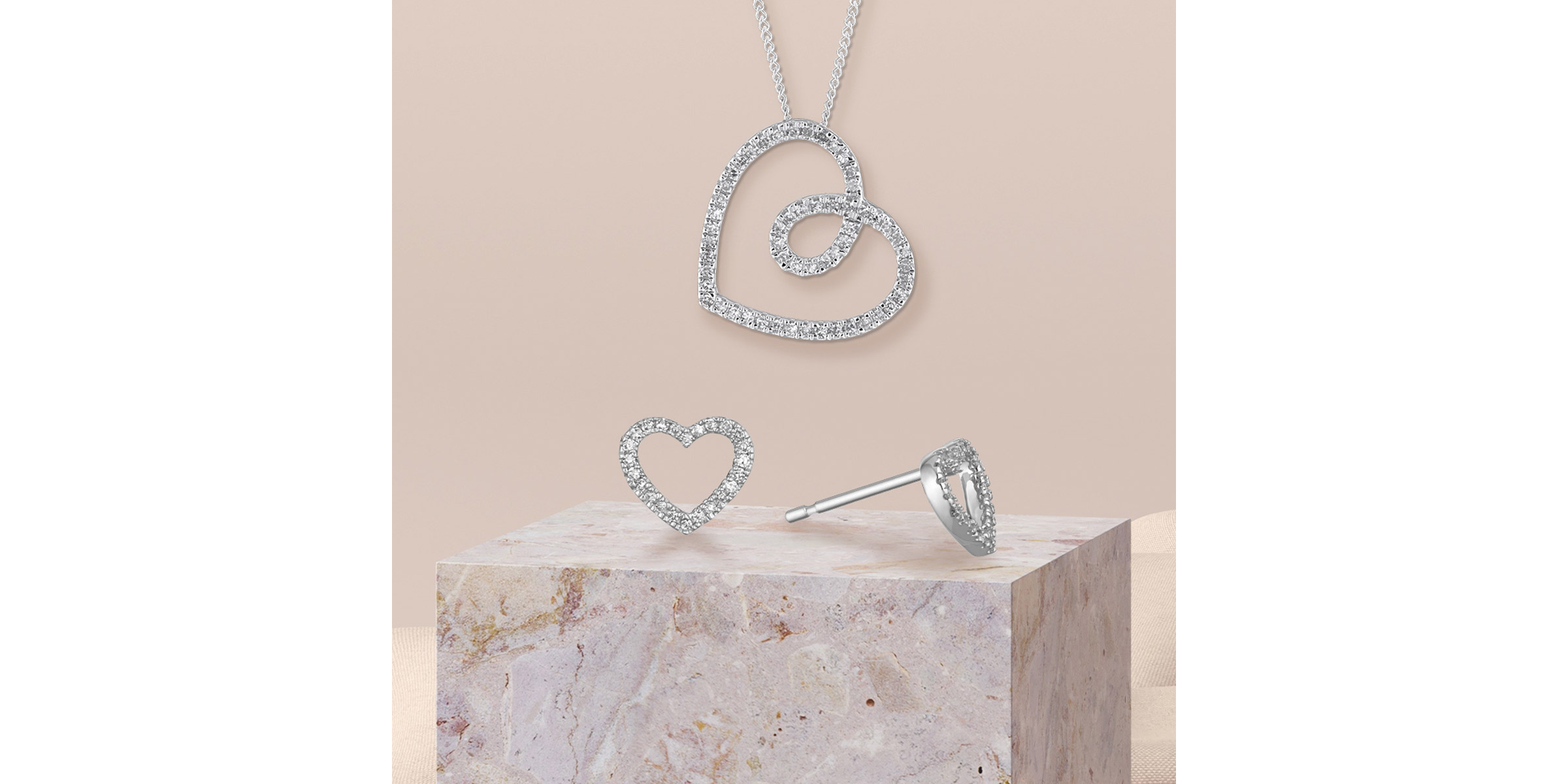 Silver heart shaped necklace and earrings